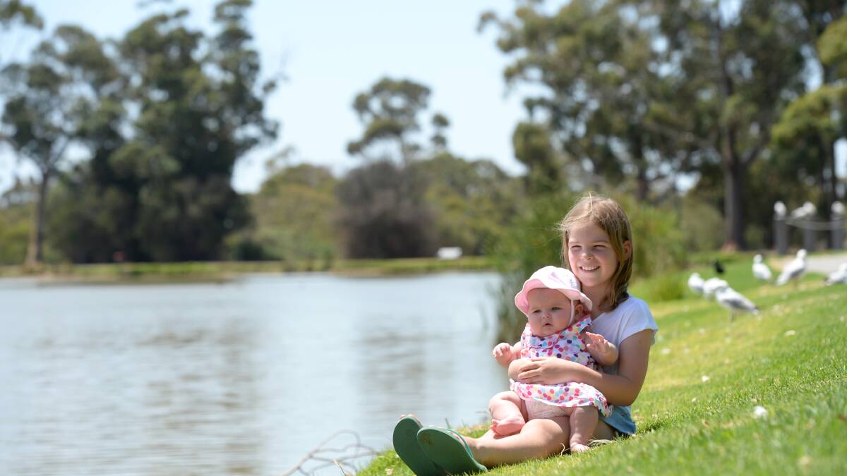 Molly Grayson, 8, and her sister Lily, 5 months, at Lake Tom Thumb.  Picture: JIM ALDERSEY