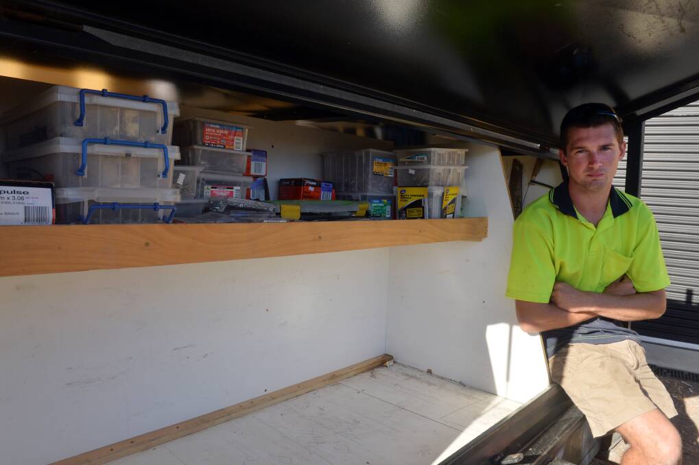 Rory Thomson at the trailer from which his work tools were stolen. Picture: BRENDAN McCARTHY