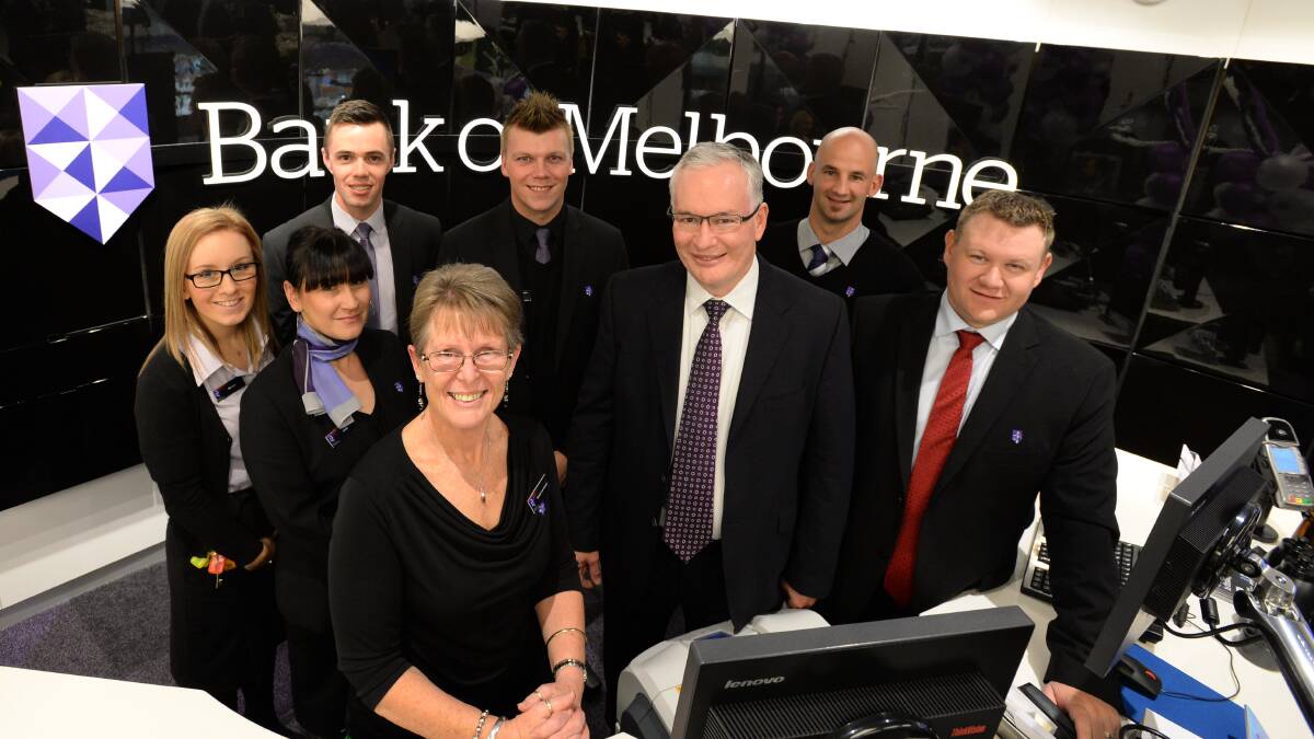 OPEN FOR BUSINESS: Bank of Melbourne branch manager Wendy Learmount with chief executive Scott Tanner and staff at the new Bendigo Marketplace branch. Picture: JIM ALDERSEY