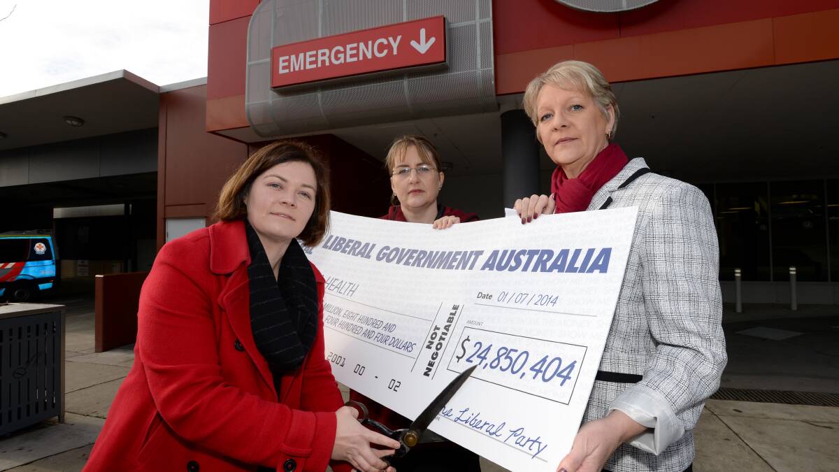 CUTS: Lisa Chesters, Jacinta Allan and Maree Edwards outside the hospital. Picture: JIM ALDERSEY