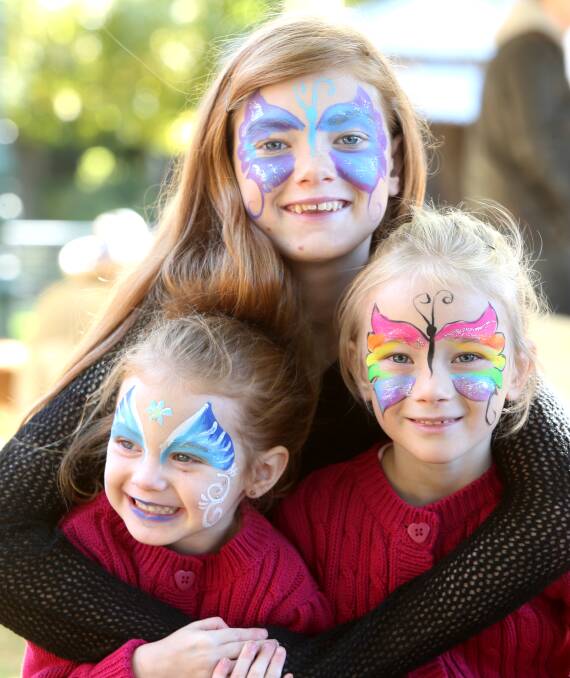 Sisters, Ella, 3, Emily, 11 and Sophie Clark, 6. Picture: GLENN DANIELS