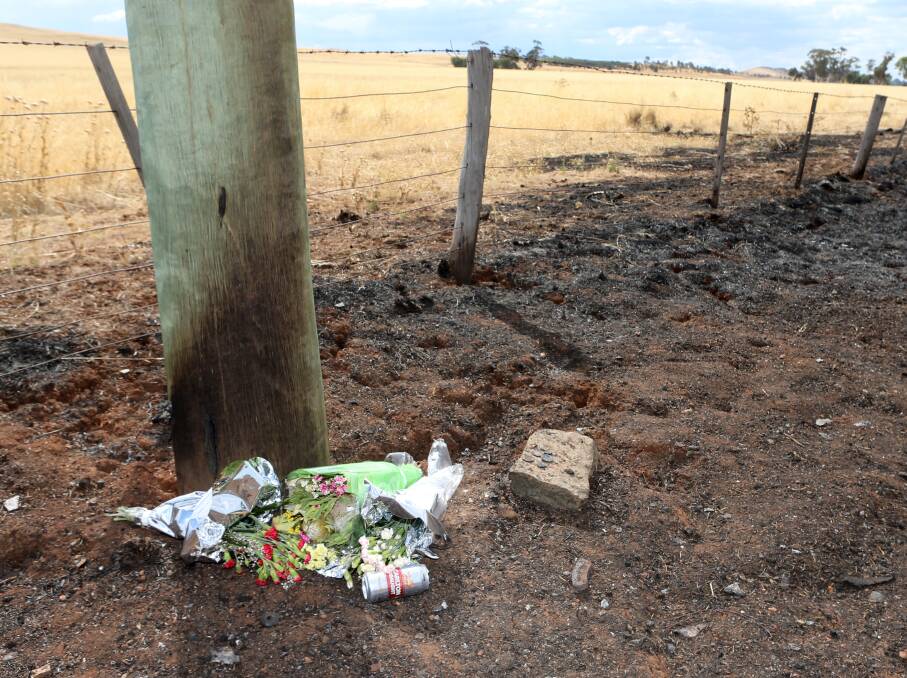 A floral tribute was left at the scene of a crash which claimed four lives. Picture: GLENN DANIELS