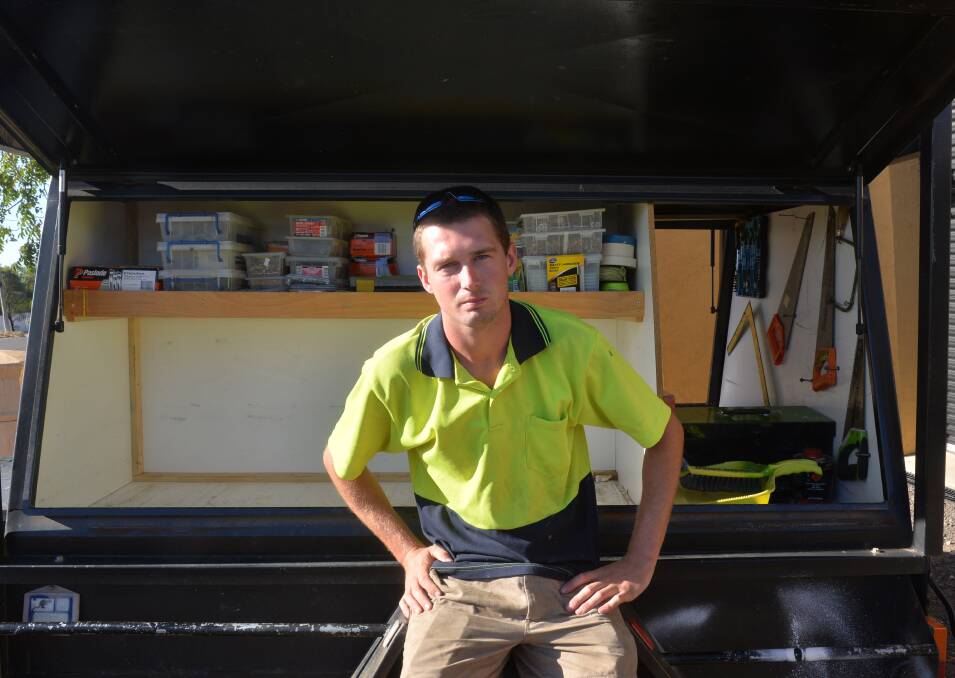 ANGRY: Rory Thomson at the trailer from which his work tools were stolen. Picture: BRENDAN McCARTHY