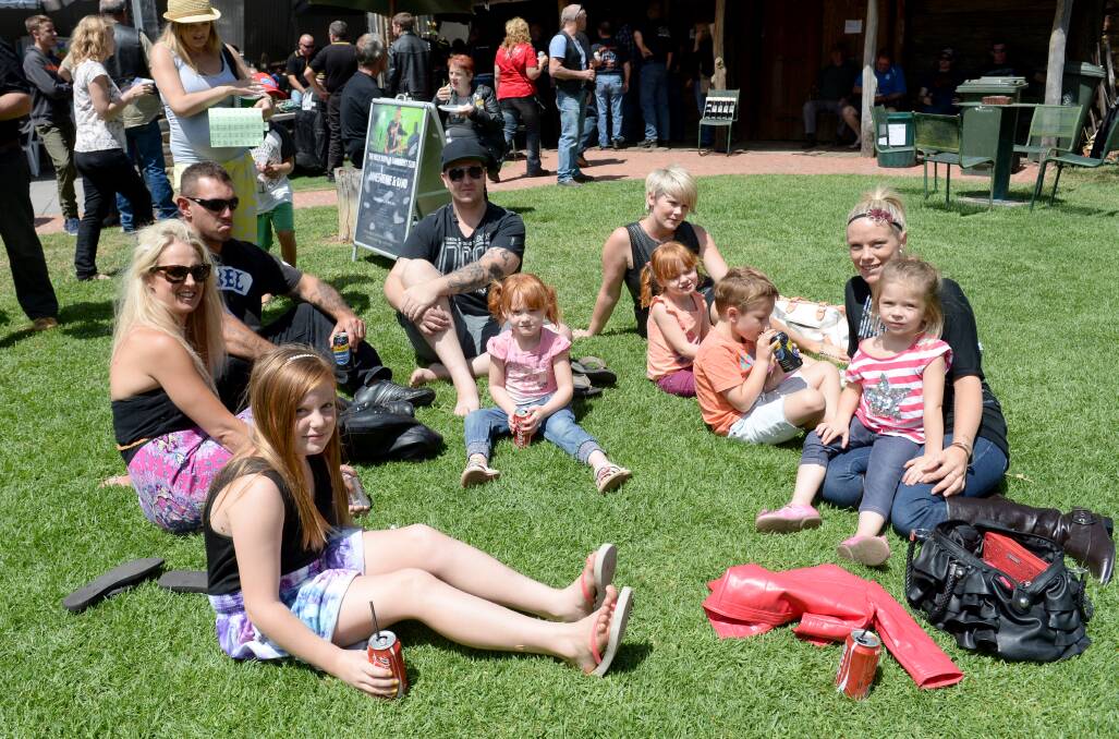 Jimmy, Yasmin, Nyssa and their families relax in the beer garden. Picture: JODIE DONNELLAN 