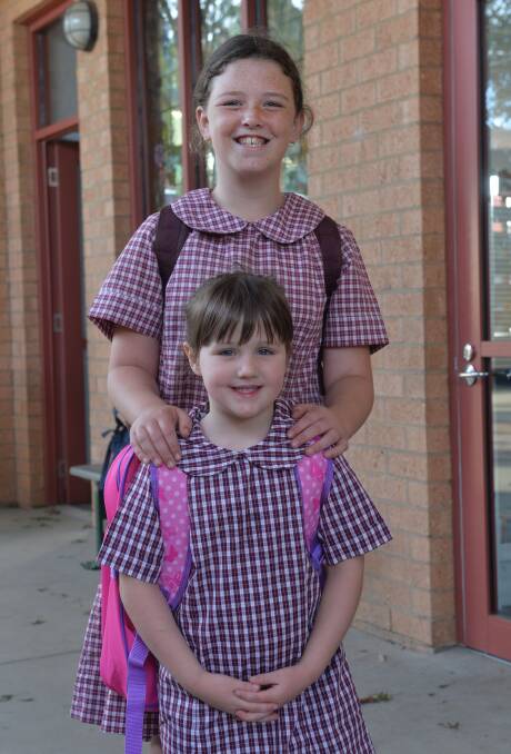 Big sister Alexis and Phoebe Dunsmuir on Phoebe's first day at St Therese's Primary School. Picture: BRENDAN McCARTHY