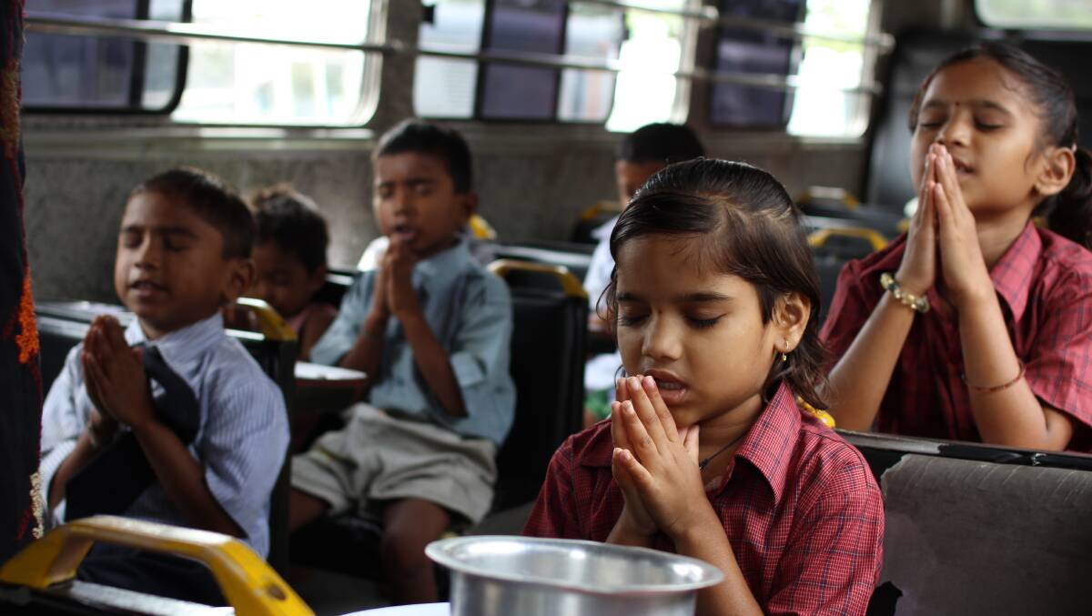 HOPE: Indian children remain full of spirit, and pray for a better world on the Vision Rescue bus.  
