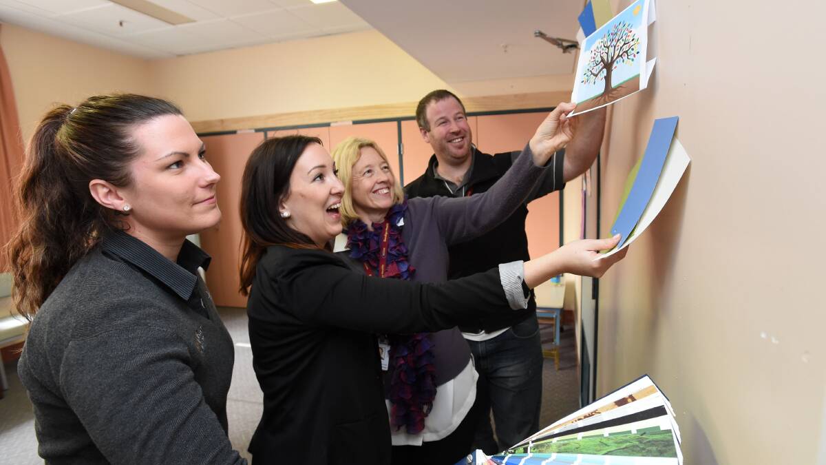 COLOURED: Haymes Paint's Zoe Braddy, colour stylist Erin Hearns, service coordinator Marie Wycisk and project manager Nick Scullie choose colours for the mural. Picture: JODIE DONNELLAN 