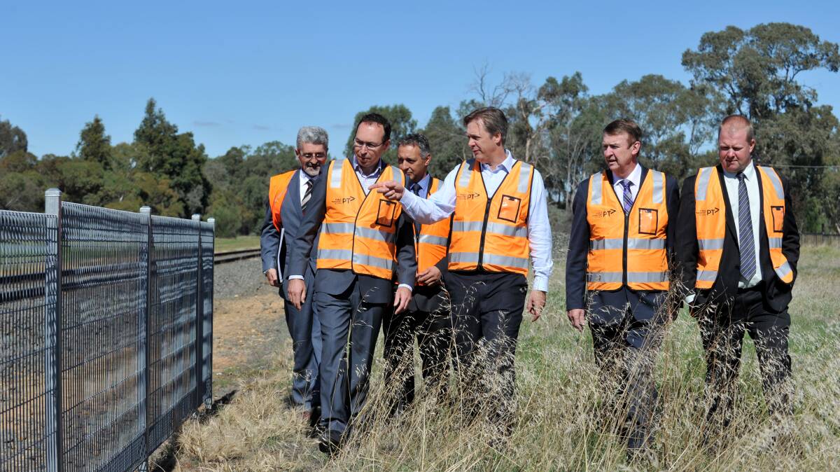 INSPECTION: VicTrack's Dragan Dasic, Public Transport Victoria's Troy O'Sullivan, VicTrack's Andrew Kyriacou, Greg Bickley, Transport Minister Terry Mulder and Jack Lyons inspect the site. Picture: JODIE DONNELLAN 