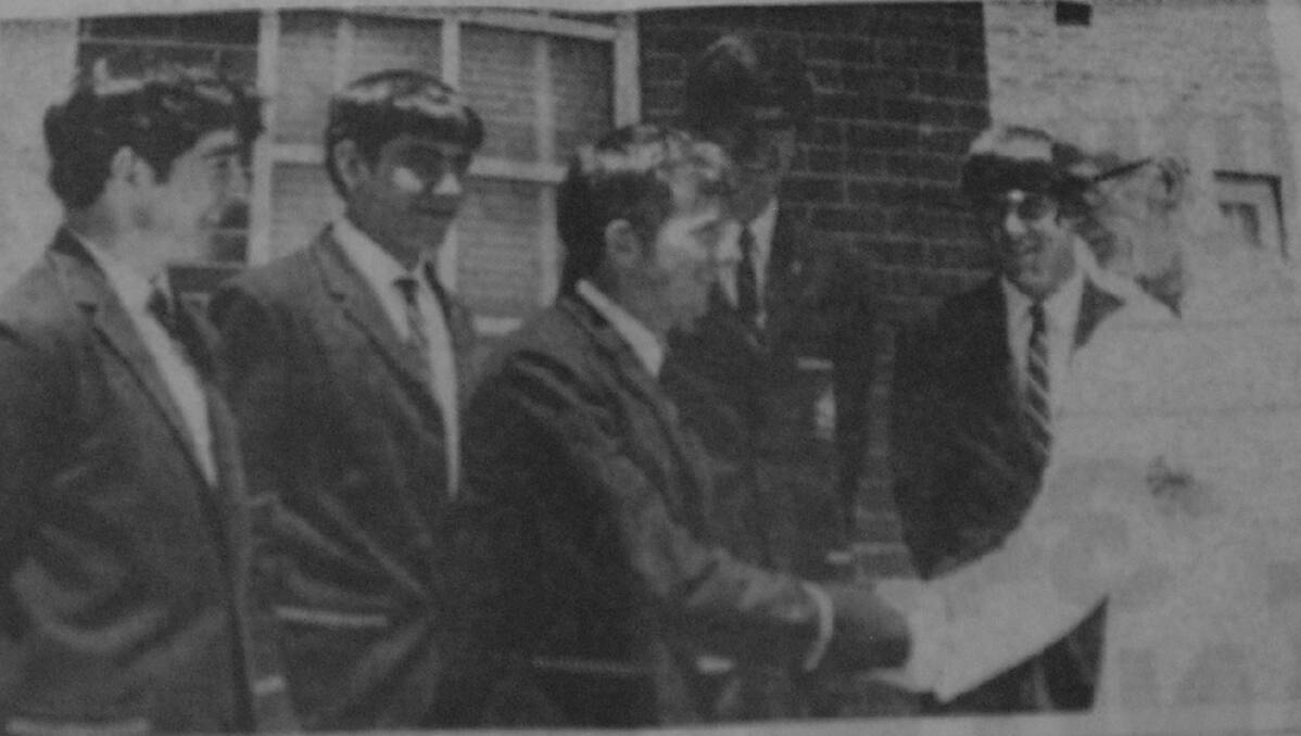 Father Mannes shakes hands with St Vincent's prefects Dennis Crameri, Dan Flyn, David Staindl, Peter Burton and Des Curtis.
