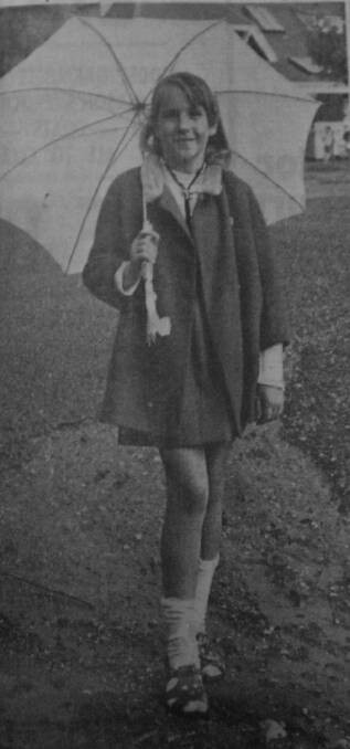 Caroline Pay of Wedderburn took her brolly to school to ward off the summer storms.
