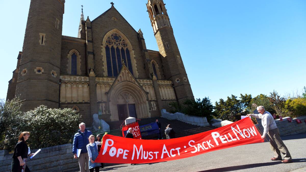 A group of Sandhurst Diocese parishioners protesting outside Sacred Heart Cathedral in Bendigo on Sunday. Picture: BRENDAN McCARTHY