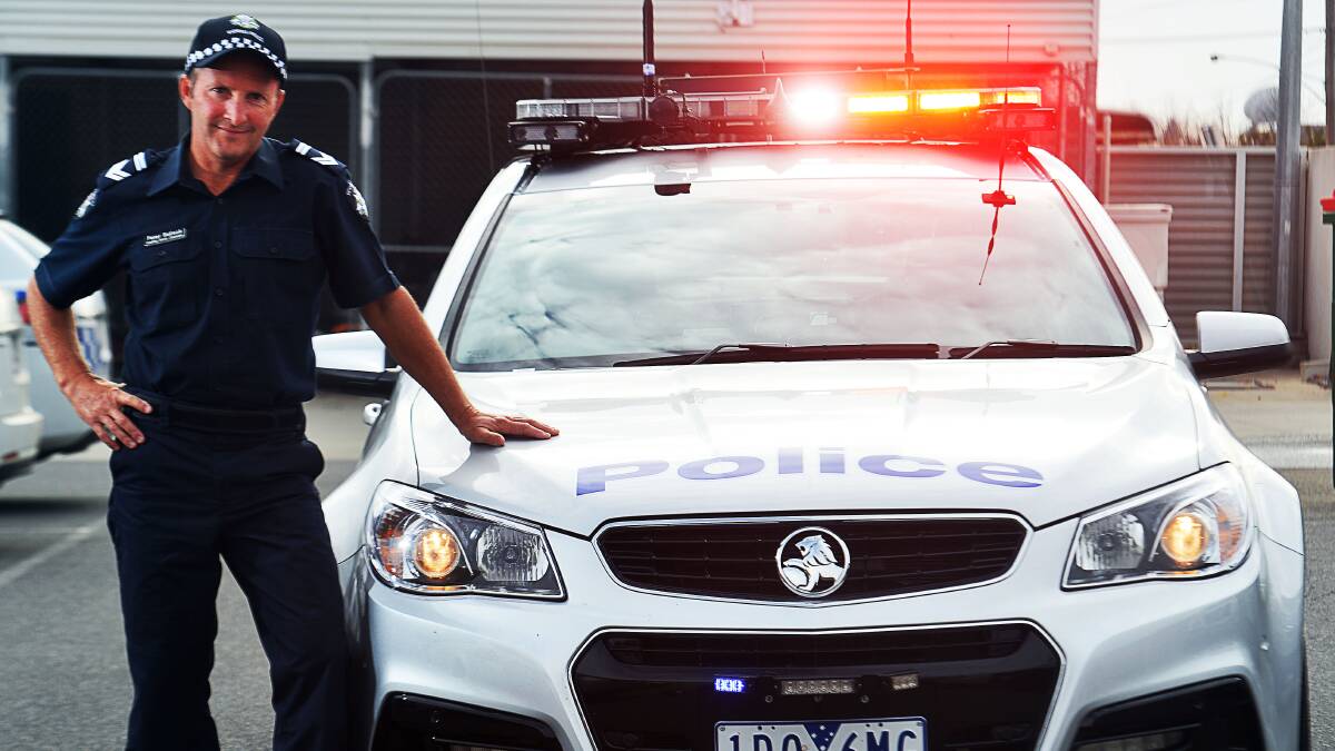 Leading Senior Constable Peter Bullock with the newly ANPR equipped Highway Patrol vehicle. Picture: BRENDAN McCARTHY
