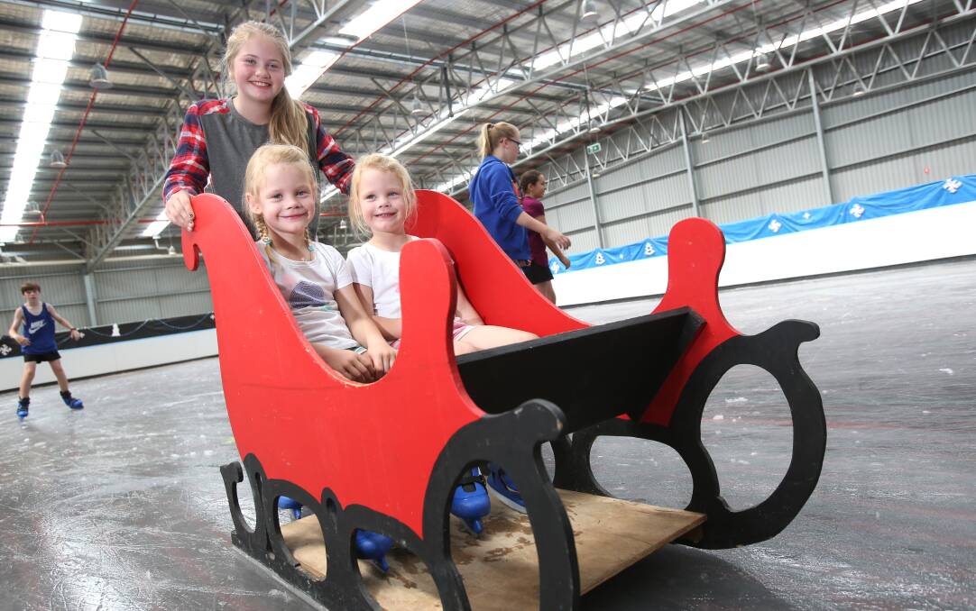 RIDE: Twins Lottie and Mia Noyce get a push from Bella Tuohey. Picture: GLENN DANIELS