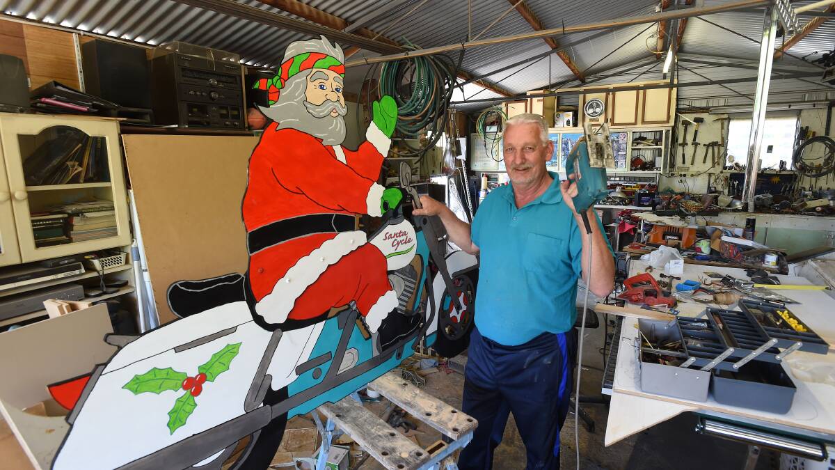 Rob Clark is busy creating new display items for this year's Bendigo Advertiser and Hume & Iser Home Hardware Christmas display competition.
Pictures: PETER WEAVING