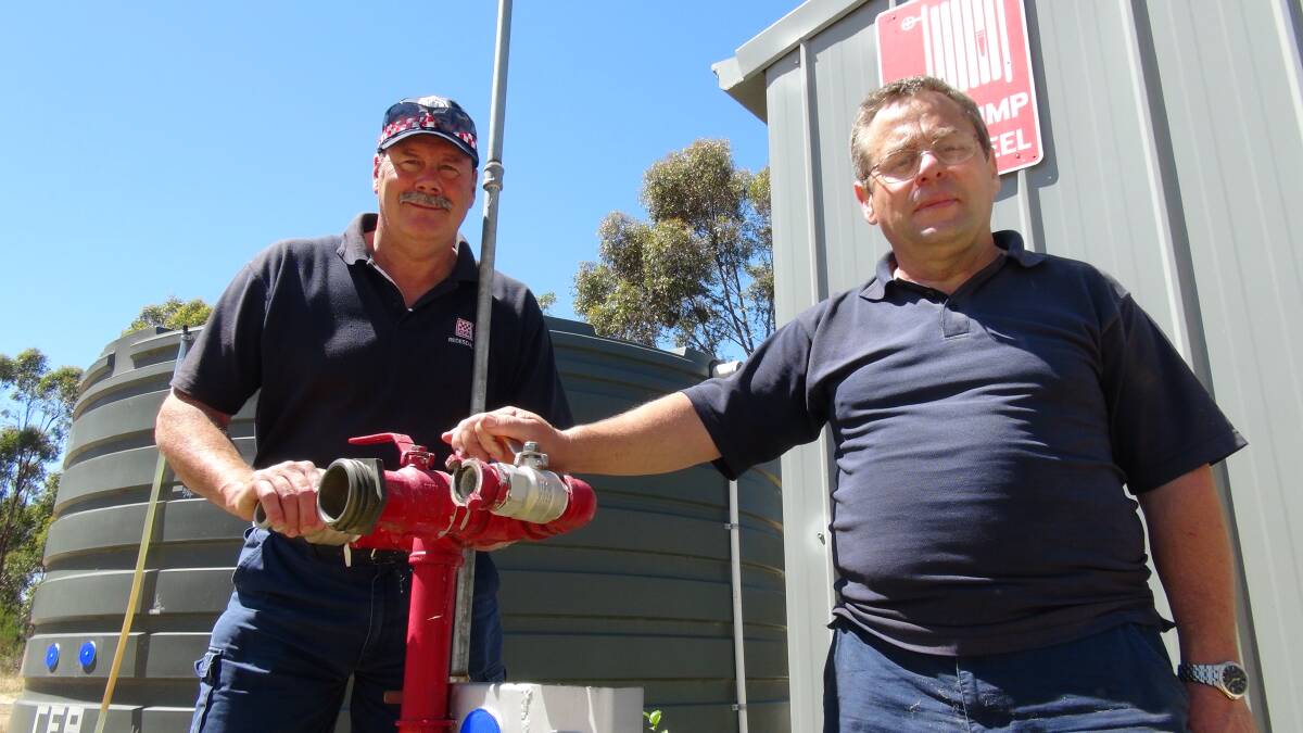 READY: Redesdale Fire Brigade's Lindsay Booker with CFA volunteer Phillip Don. Picture: LEIGH SHARP 