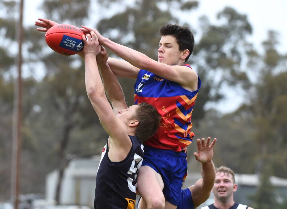 PANTHER SOARS: Marong’s Jared Greenhill flies for a mark against Inglewood. Picture: JIM ALDERSEY