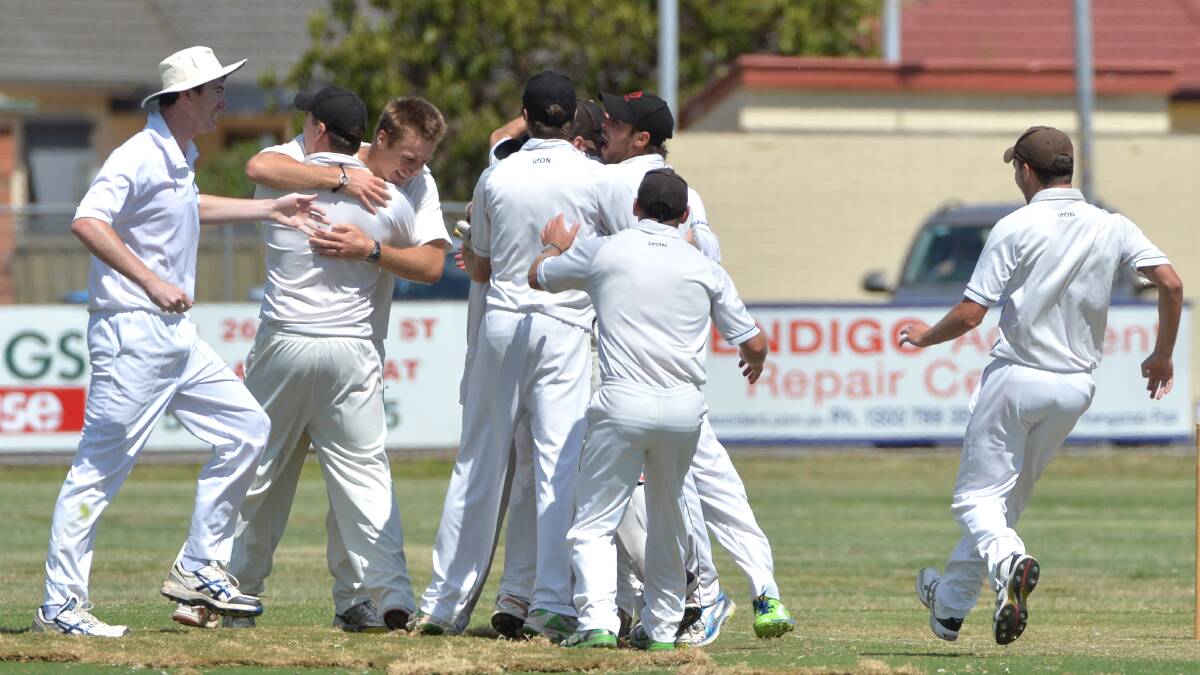 The Demons celebrate their match-winning wicket.