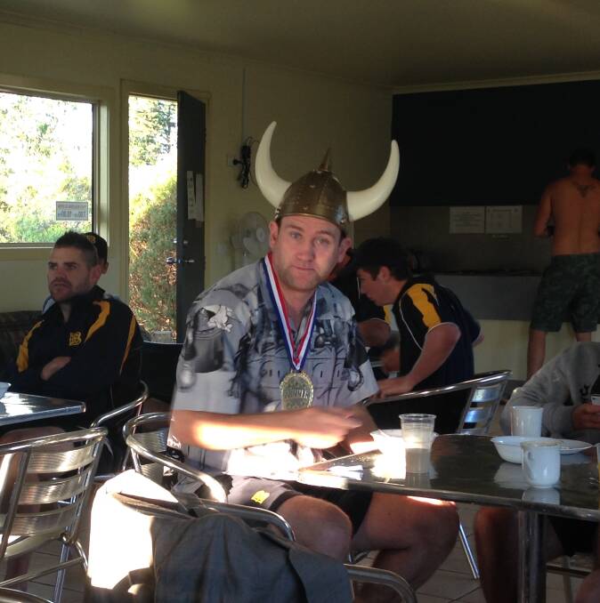 SMILE FOR THE CAMERA: Ben DeAraugo wears the man-of-the-match viking helmet, shirt and medal at breakfast on Tuesday ahead of Bendigo's clash with Sale-Maffra. Picture: CAMERON TAYLOR