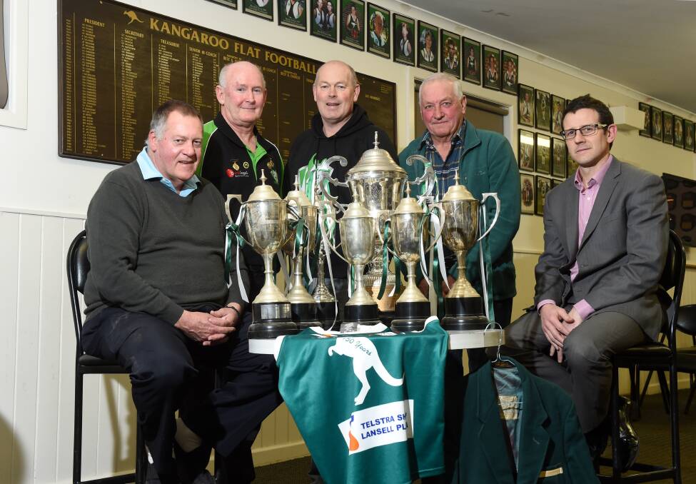 STALWARTS: Kangaroo Flat’s Trevor Curran, Gary Place, president Rob Clohesy, Noel McClue and Chris Harrington with the seven premierships cups that symbolise the seven senior grand final wins the Roos have in their history. The club will hold a weekend of 150th anniversary celebrations. Picture: JODIE DONNELLAN
