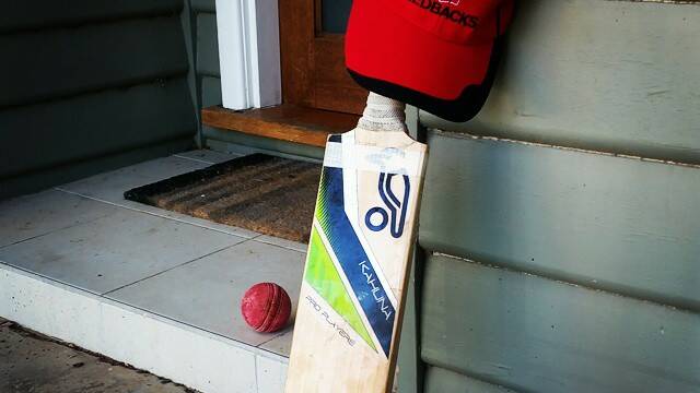 RESPECT: A cricket bat outside a Bendigo house.