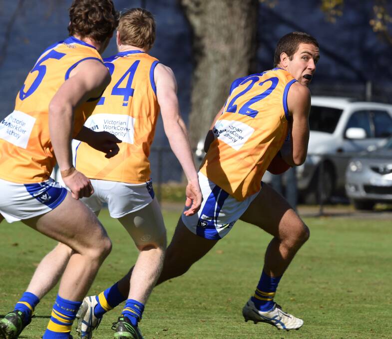 ON THE BURST: Bendigo's Anthony Bigham with possession. Pictures: LACHLAN BENCE