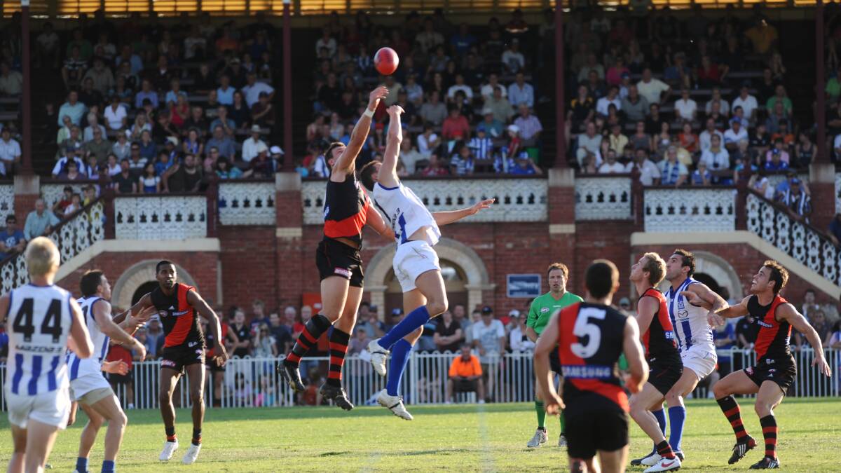 BIG MEN  FLY: Essendon and North Melbourne were the last teams to play an AFL practice match at the QEO in 2009. The Roos won by 17 points.