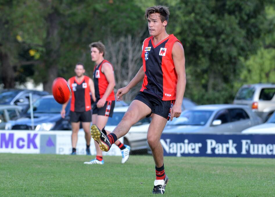 STAR RECRUIT: Jake Ward kicks for White Hills in Saturday's loss to Mount Pleasant. Ward booted two of the Demons' eight goals. Picture: LIZ FLEMING