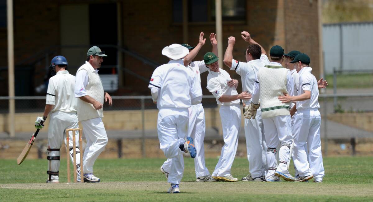 GOT HIM: Kangaroo Flat players celebrate the wicket of Bendigo's Craig Pearce for six on Saturday.