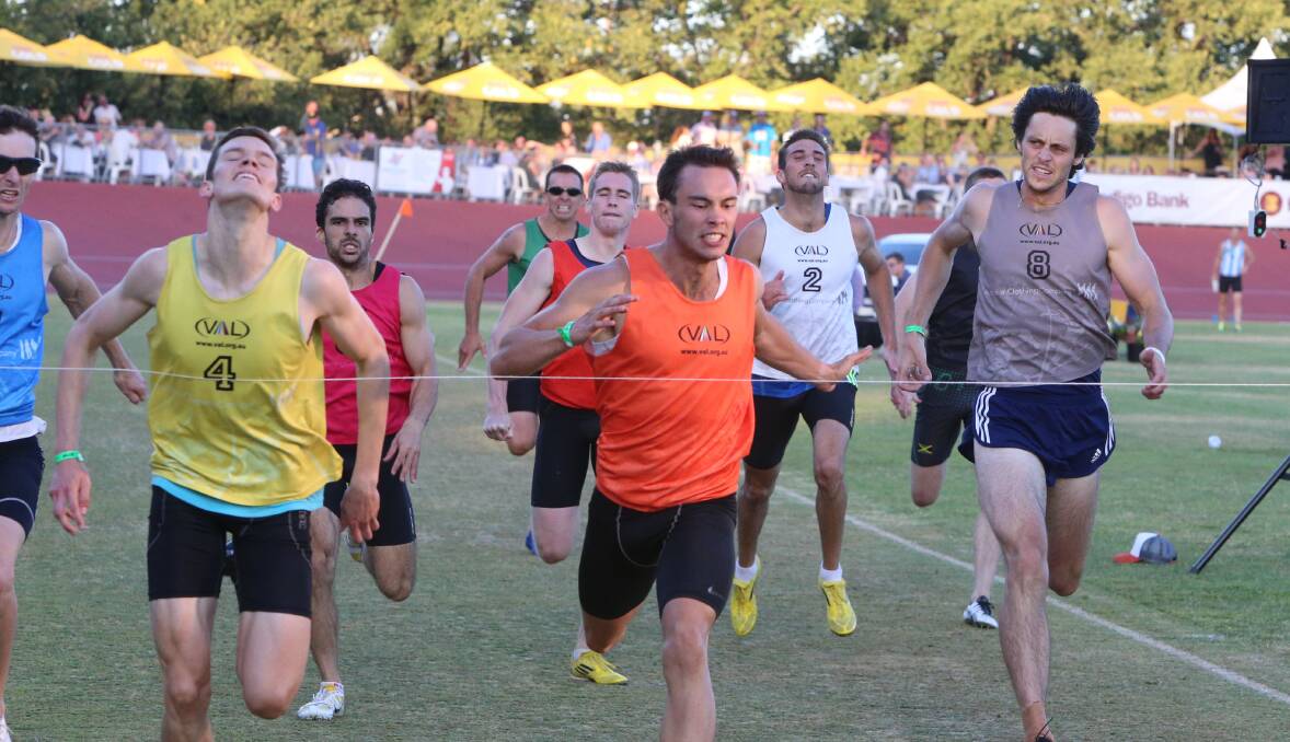 LUNGE: Cameron Moss (yellow) gets to the line first in the coveted 400m Black Opal final.