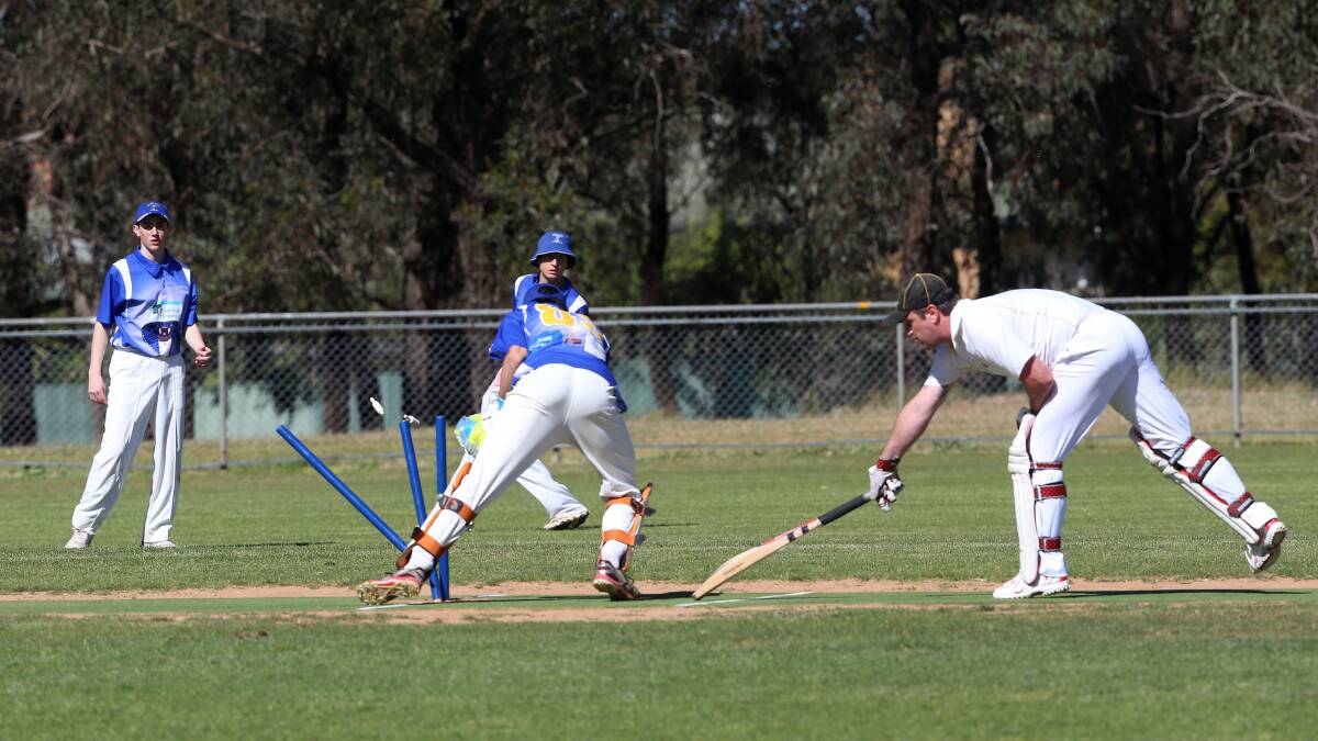 United's Andrew Gaul grounds his bat.