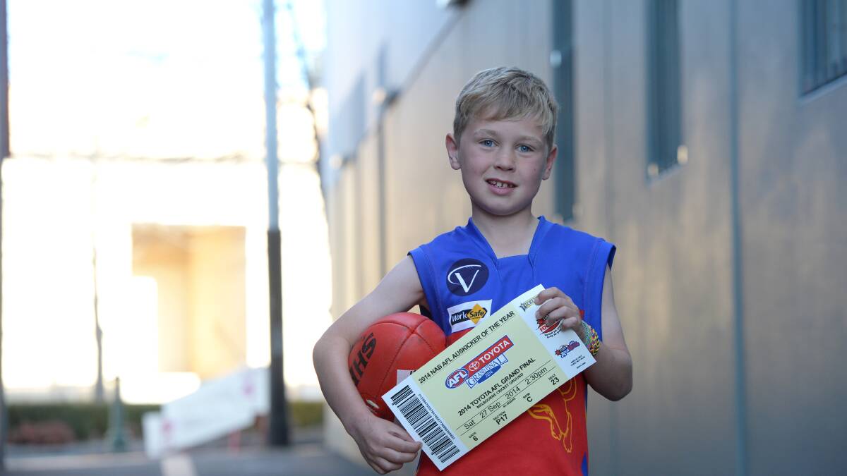 GRAND PRIZE: Flynn Rowbottom with his AFL grand final ticket.