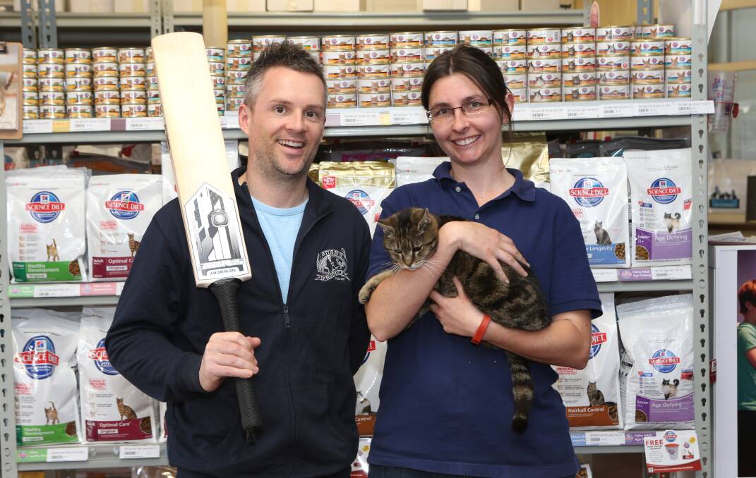 AWARD SUPPORT: Bush’s Produce Stores’ Nick Crawford and Melissa Debnam with Tiger the cat.