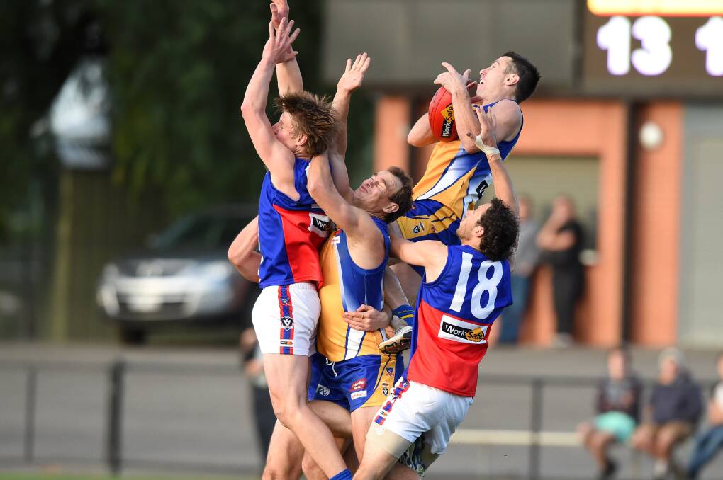SOARING OVER THE PACK: Stephen Milne takes a hanger in the last quarter. 