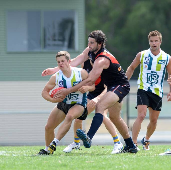 CRUNCH: Daniel Toman is tackled by Jeremy Lambden.