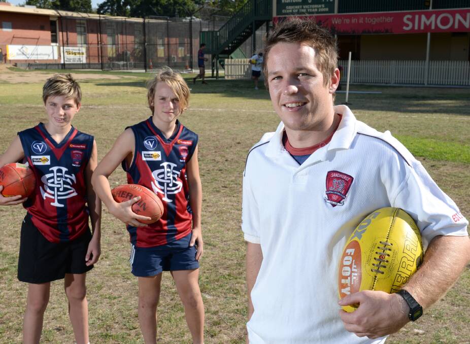 BIG YEAR AHEAD: Sandhurst under-14 players Zac Sims and Nathan Murley with Lee Coghlan.