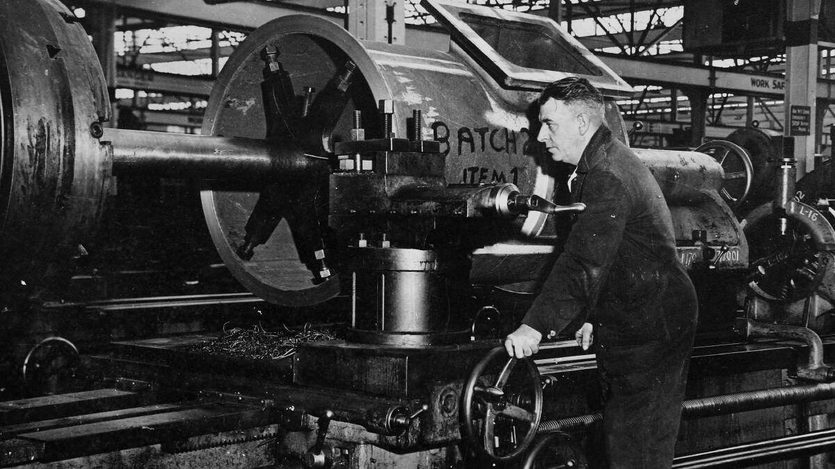 A Bendigo Ordnance Factory staff member works on a section of the exhaust manifold for a Doxford opposed piston diesel engine. Date unknown. Do you know this worker?