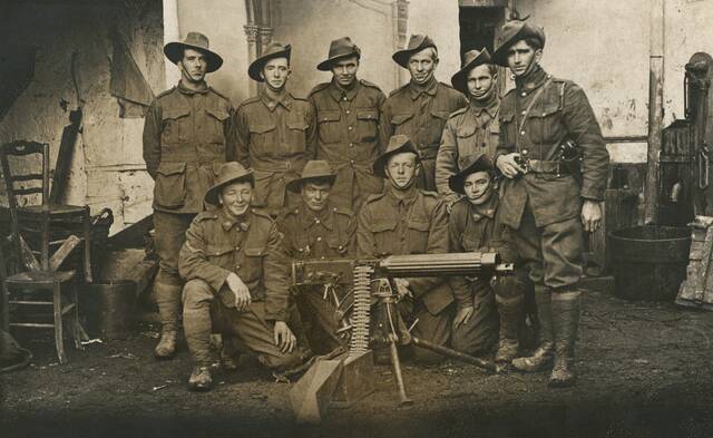 HISTORIC: ID number          P10447.007.001. France: Picardie, Somme, Vignacourt. C 1916. Group portrait of the No. 4 Section, 2nd Machine Gun Company (later transferred to 1st Machine Gun Battalion). Back row, left to right: 2593 Private (Pte) Henry Percival Hargreaves; 3928 Pte William Sherlock Robins MM; 1932 Pte Horace Wildamere Clarke; 4279 Pte Hugh Terrence O'Reilly; 529 L Cpl Donald Cameron; 27 Sgt Percival Carl Minifie. Front row: 1662 L Cpl George Thomas Pyke; 1917 (previously 2112) Pte John Henry Melhuish Belgian Croix de Guerre; 1126 (1182) Sgt George Albert Radnell DCM; 4437 Pte Leslie Stephen Boardman.
27 Sgt (later Lieutenant) Percival Carl Minifie, a railway man from Watchem, Victoria, prior to enlisting on 18 August 1914, embarked from Melbourne aboard HMAT Benalla (A24) in October that same year. He was killed in action at Broodseinde, Belgium, in the early morning of 4 October 1917. 4437 Pte Leslie Stephen Boardman, a labourer from Gippsland, Victoria, embarked from Melbourne aboard HMAT Themistocles (A32) on 28 January 1916. Pte Boardman was killed in action at Lagnicourt, France, on 26 April 1917. He was 19 years of age. Picture: AUSTRALIAN WAR MEMORIAL COLLECTION