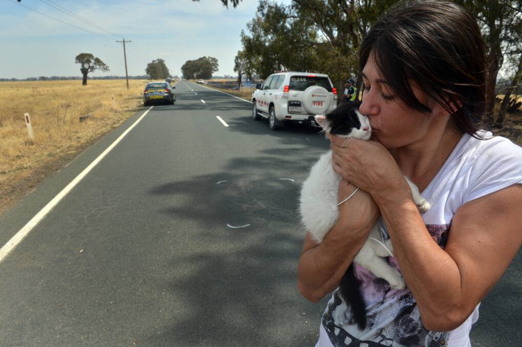 LUCKY: Jodie Spencer fled the burning car with her cat. Picture: BRENDAN McCARTHY