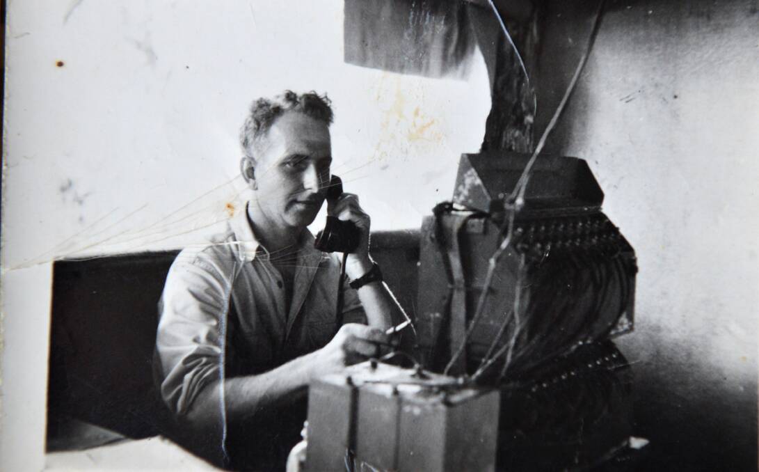 The Herb Dixon collection - Frank Dunphy on the radio in Finchhafen, Papua New Guinea.