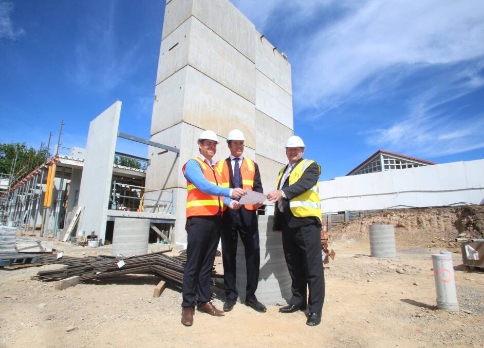 LAUNCH: Damien Crough, Will Deague and Mayor Barry Lyons inspect the preparation works for Bendigo's newest hotel at the Bendigo Hospital site in November. Picture: LIZ FLEMING