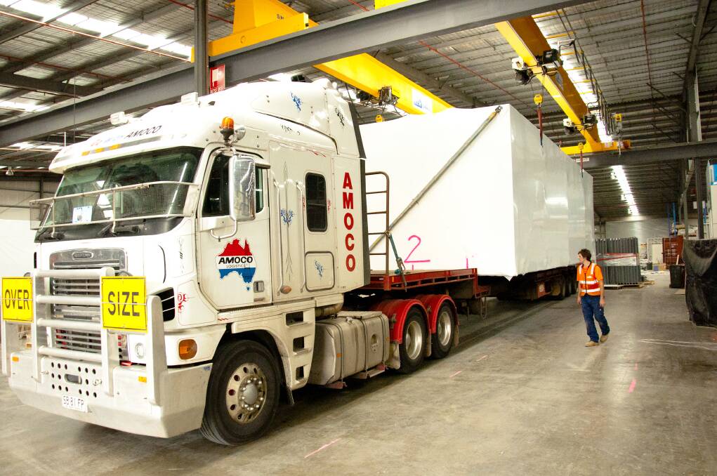ALL SET: A generic picture of a module being loaded onto a truck at Hickory Group's Melbourne factory.