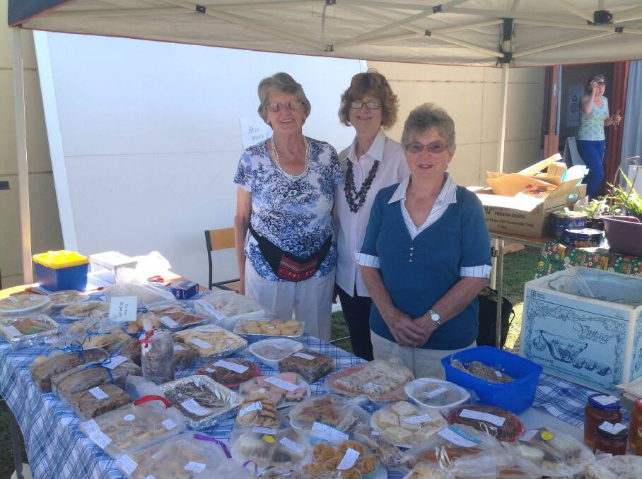 FUNDRAISING: Elizabeth McQueen, Melva Hall and Heather Ryall sell goodies outside the Strathfieldsaye Community Church polling booth. Picture: ANDI YU