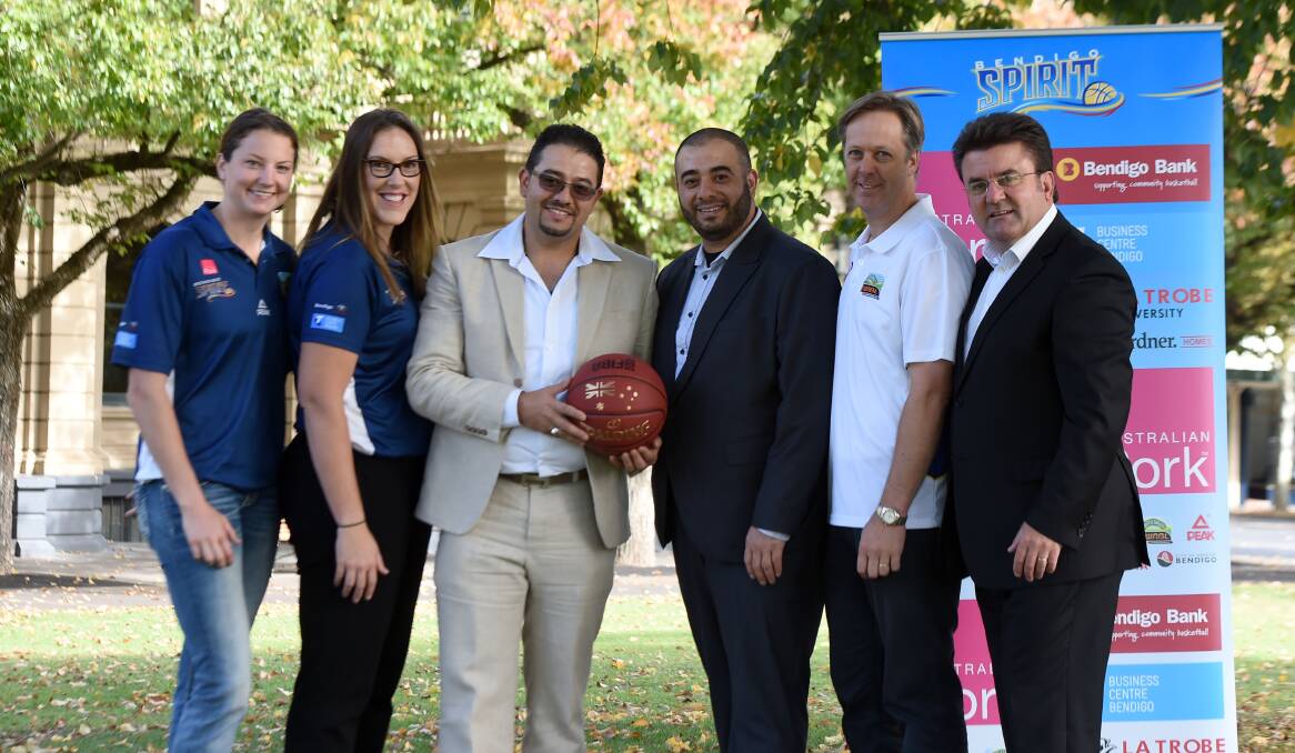 DONATION: Bendigo Spirit players Kelsey Griffin and Gabe Richards, Fiesta Food and Events owners Ahmed and Ibo Safi, Bendigo Spirit chairman Greg Bickley and City of Greater Bendigo major events manager Terry Karamaloudis. Picture: JODIE WIEGARD