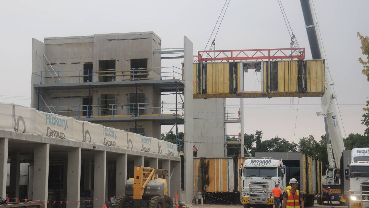 PUZZLE PIECE: Modules being put into place at a hotel on the new Bendigo Hospital project. Picture: JOSH FAGAN