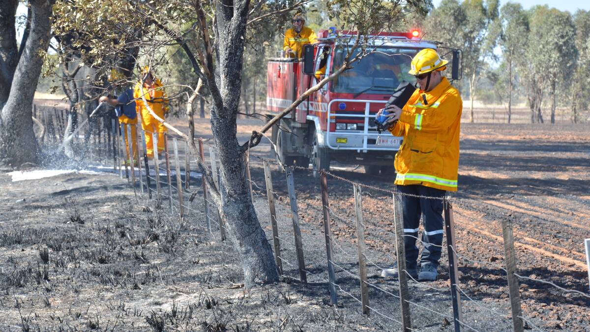 MONITORING: Fire crews at Toolleen look for hotspots that are at risk of re-igniting. Picture: PETER WEAVING