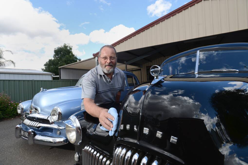 Rick Kingsley with his Blue FJ Holden and Black FX Holden.
Picture: JIM ALDERSEY