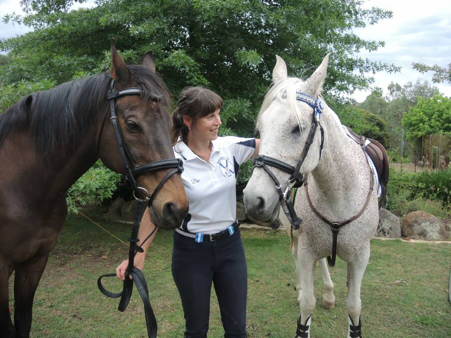 ALL SMILES: Bec Hughes with her two horses Angus and Seph. Picture: KRISTEN ALEBAKIS
