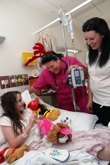 Lauren Mackenzie being cared for by Bec King and Justine Jackel. Picture: LIZ FLEMING
