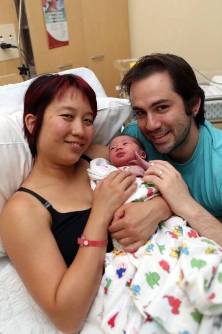 CHRISTMAS JOY: Kat and Evan Ritchie with their newborn daughter Marceline. 
Pictures: LIZ FLEMING