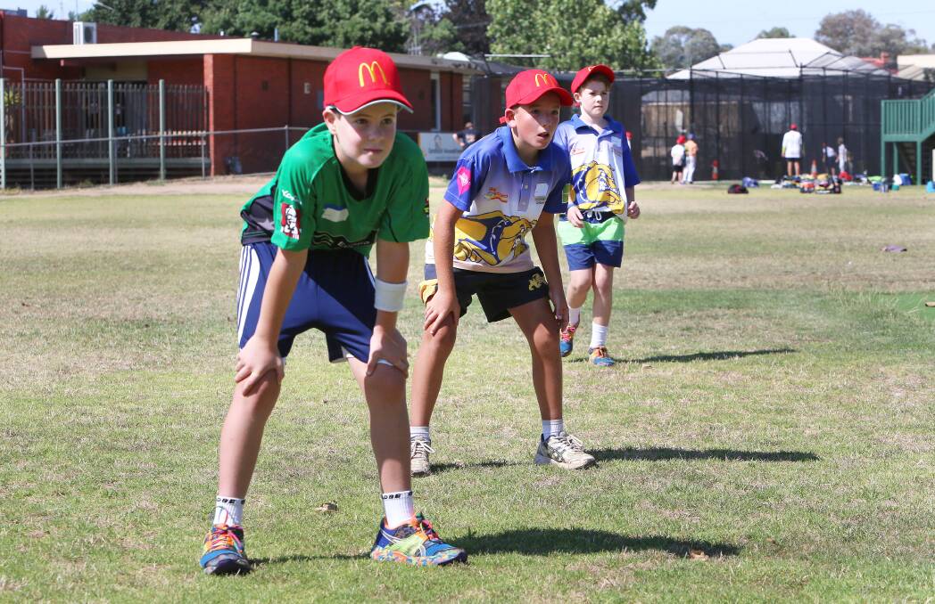 McDonald's Summer Cricket Camp at Ewing Park Bendigo.
James Barri and Tom Campbell ready for a catch. Picture: PETER WEAVING